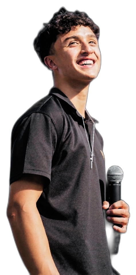 Ian Waite holding a microphone